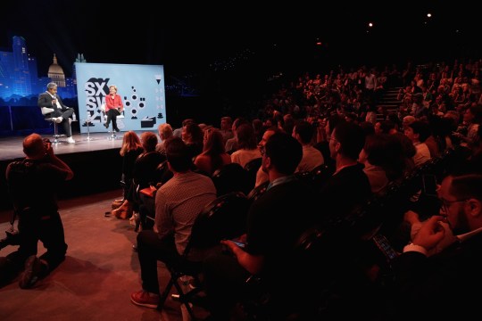 Anand Giridharadas (L) and Elizabeth Warren speak onstage at the Conversations About America's Future series at Austin City Limits Live at the Moody Theater - Photo by Amy E. Price/Getty Images for SXSW