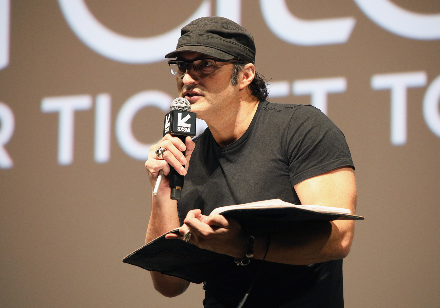Robert Rodriguez speaks onstage at The Robert Rodriguez Film School and Red 11 premiere at Atom Theater.