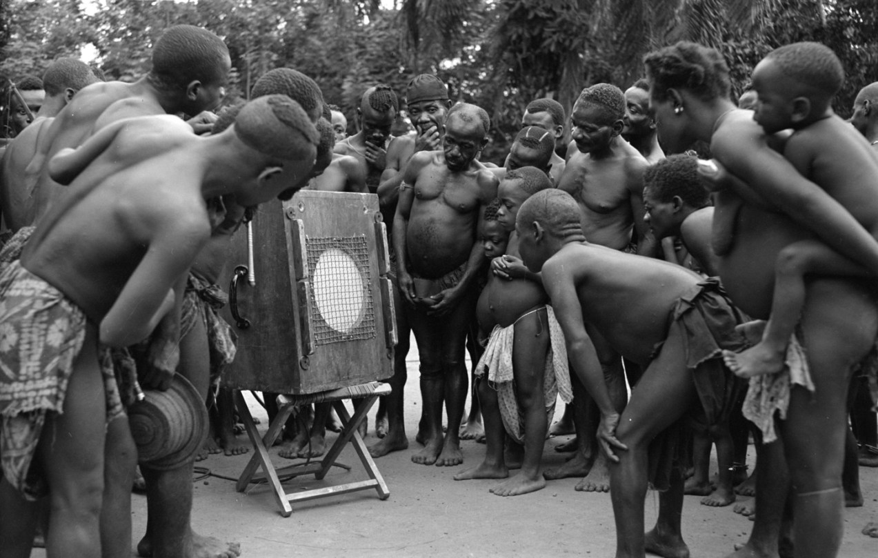 In this 1952 photo that inspired Beating Heart’s creation, Mbuti Pygmies listen to a recording of their own music made by ethnomusicologist Hugh Tracey. Photo courtesy of Chris Pedley.