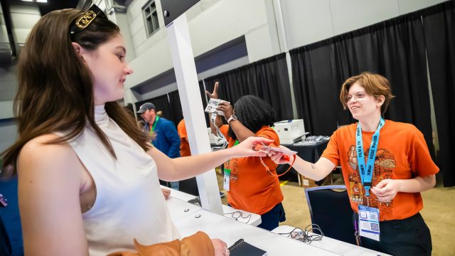 Registration Volunteers and Attendee – SXSW 2024 – Photo by Aaron Rogosin