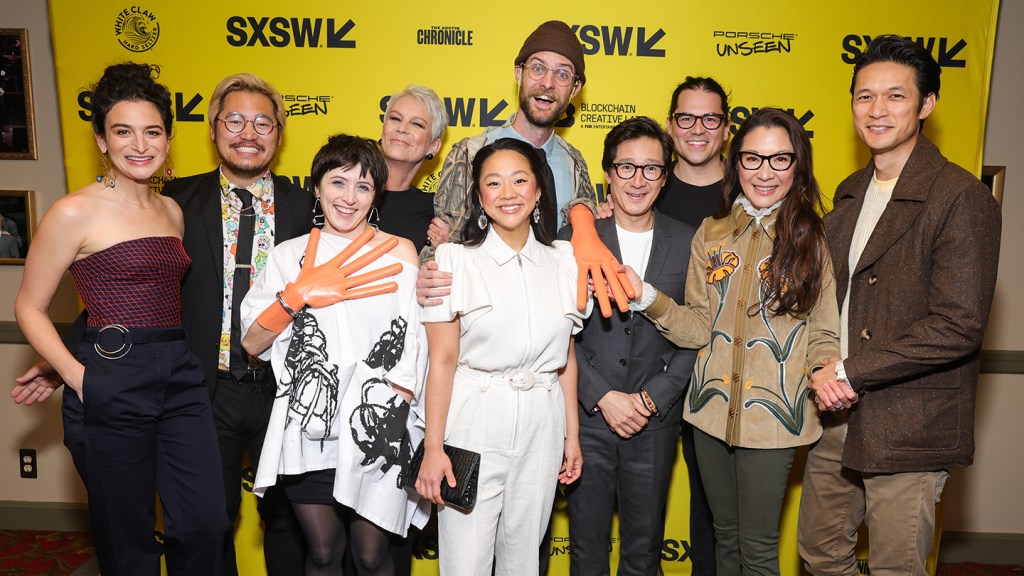 AUSTIN, TEXAS - MARCH 11: (L-R) Jenny Slate, Daniel Kwan, Tallie Mendel, Jamie Lee Curtis, Daniel Scheinert, Stephanie Hsu, Ke Huy Quan, Jonathan Wang, Michelle Yeoh and Harry Shum Jr. attend the opening night premiere of "Everything Everywhere All At Once" during the 2022 SXSW Conference and Festivals at The Paramount Theatre on March 11, 2022 in Austin, Texas. (Photo by Rich Fury/Getty Images for SXSW)